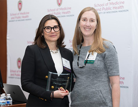 Pelin receiving award